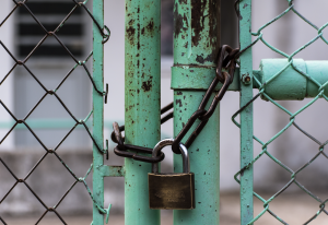 a padlock holds a gate closed representing VR integration security