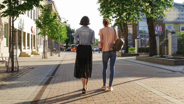 2 women walking side by side