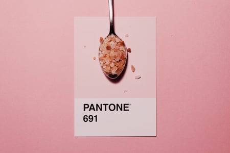 Pantone color swatch with pink salt on spoon